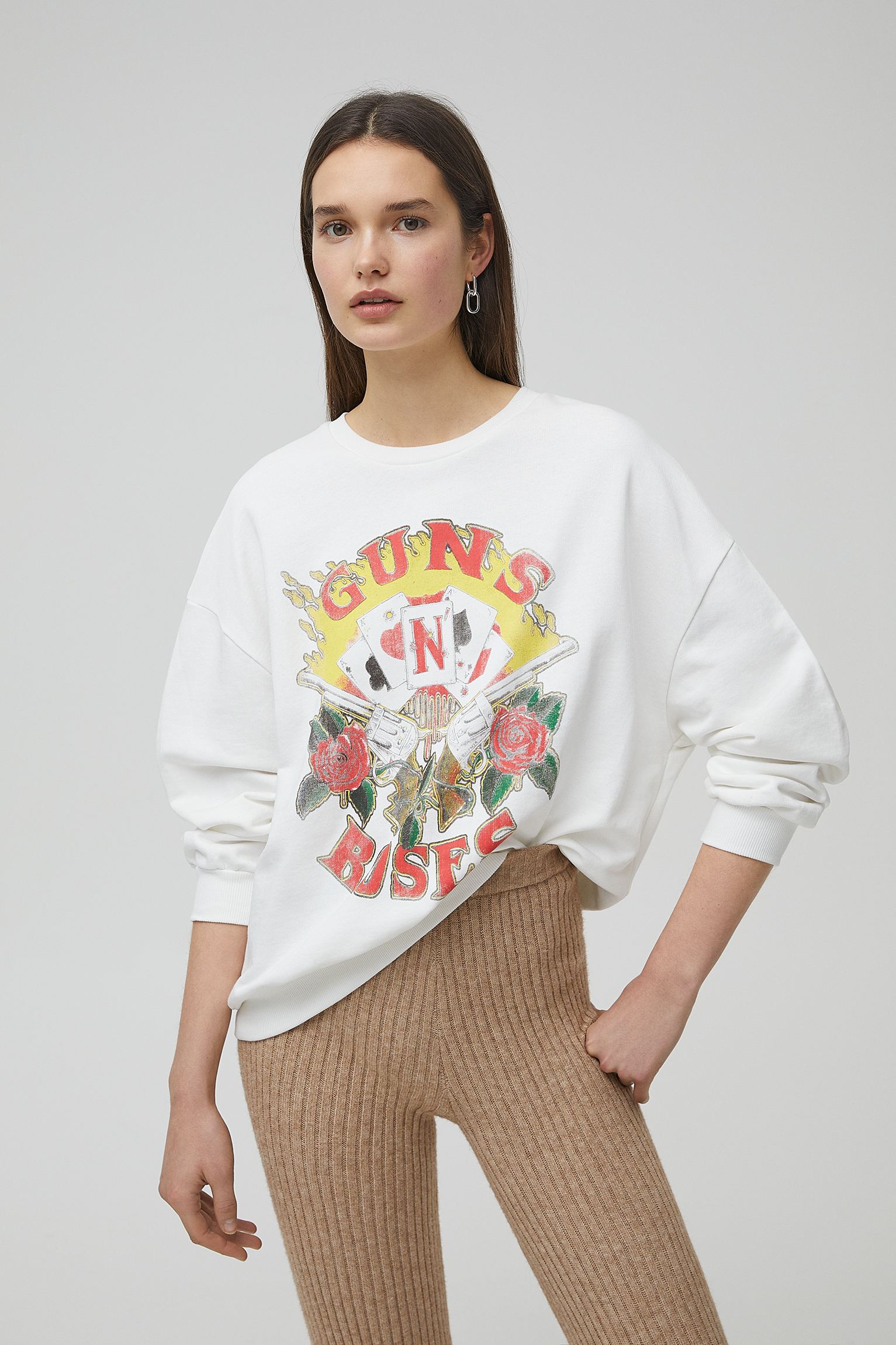 white sweatshirt with roses