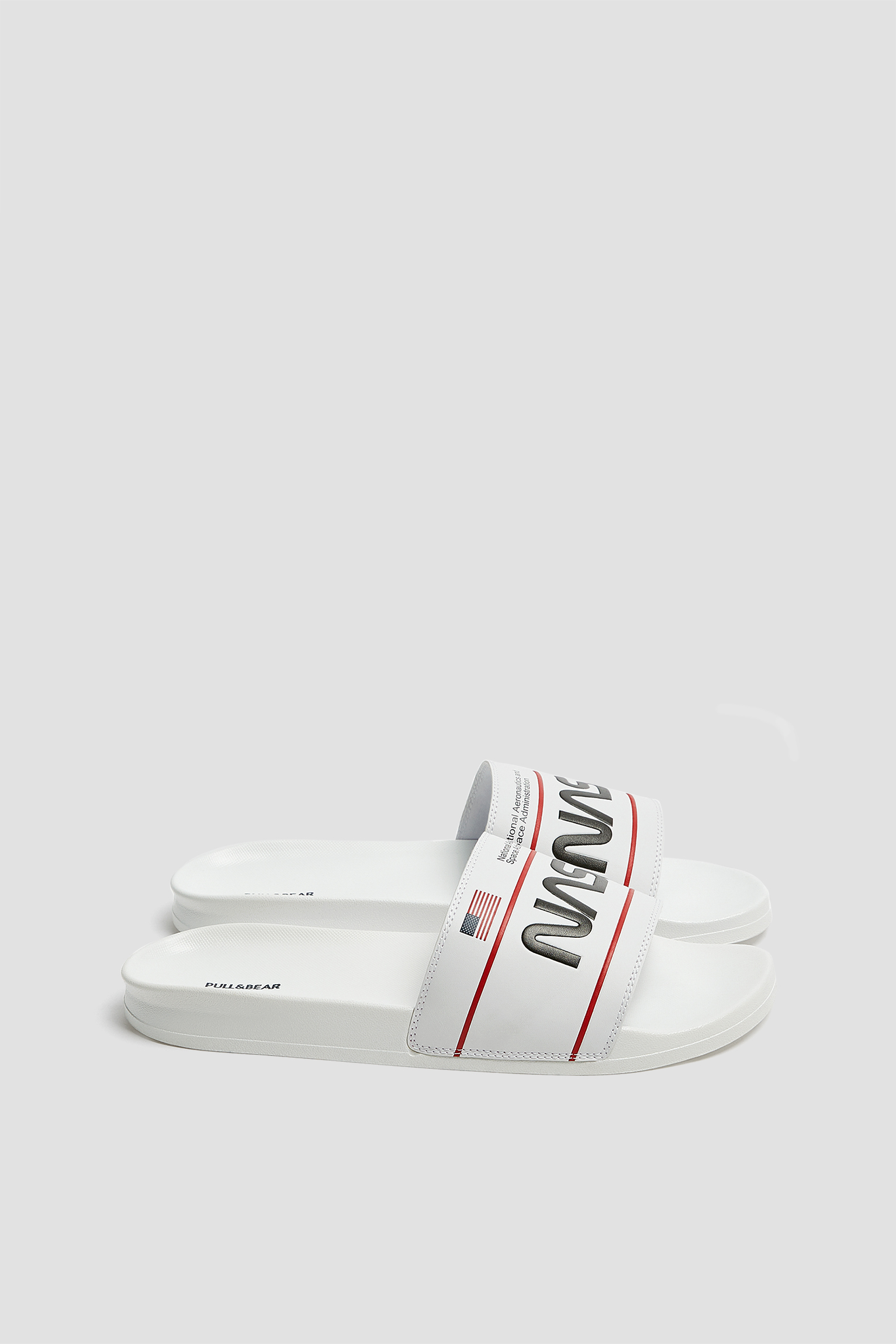 Buy Pull \u0026 Bear black NASA slide sandals for Men in MENA, Worldwide
