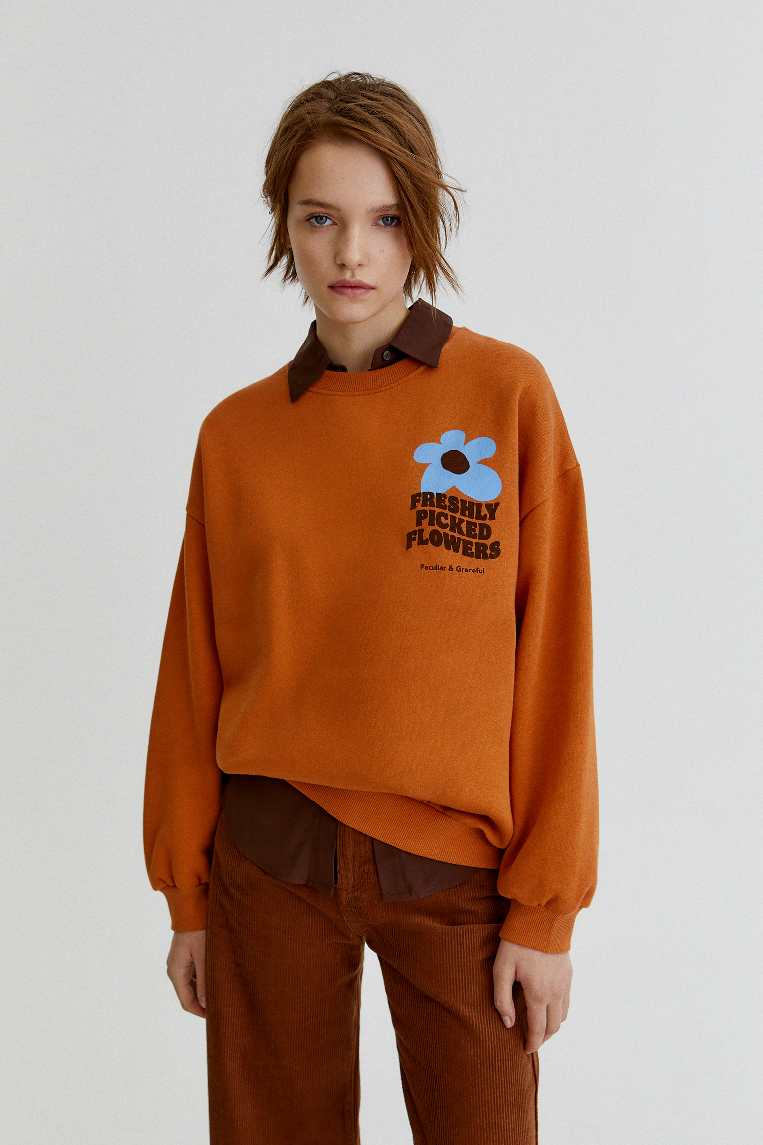 orange graphic sweatshirt