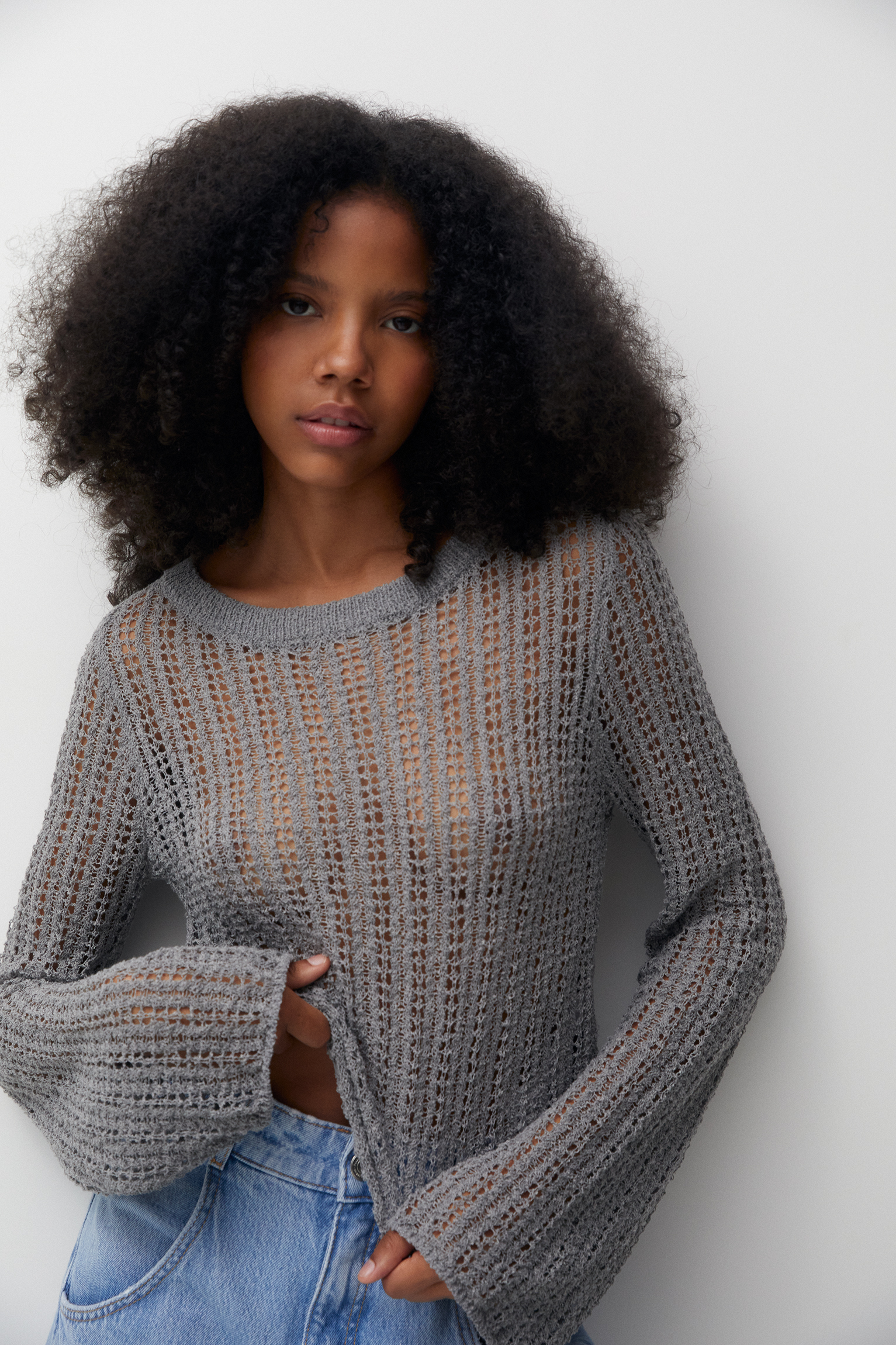 Openwork knit sweater with flared sleeves