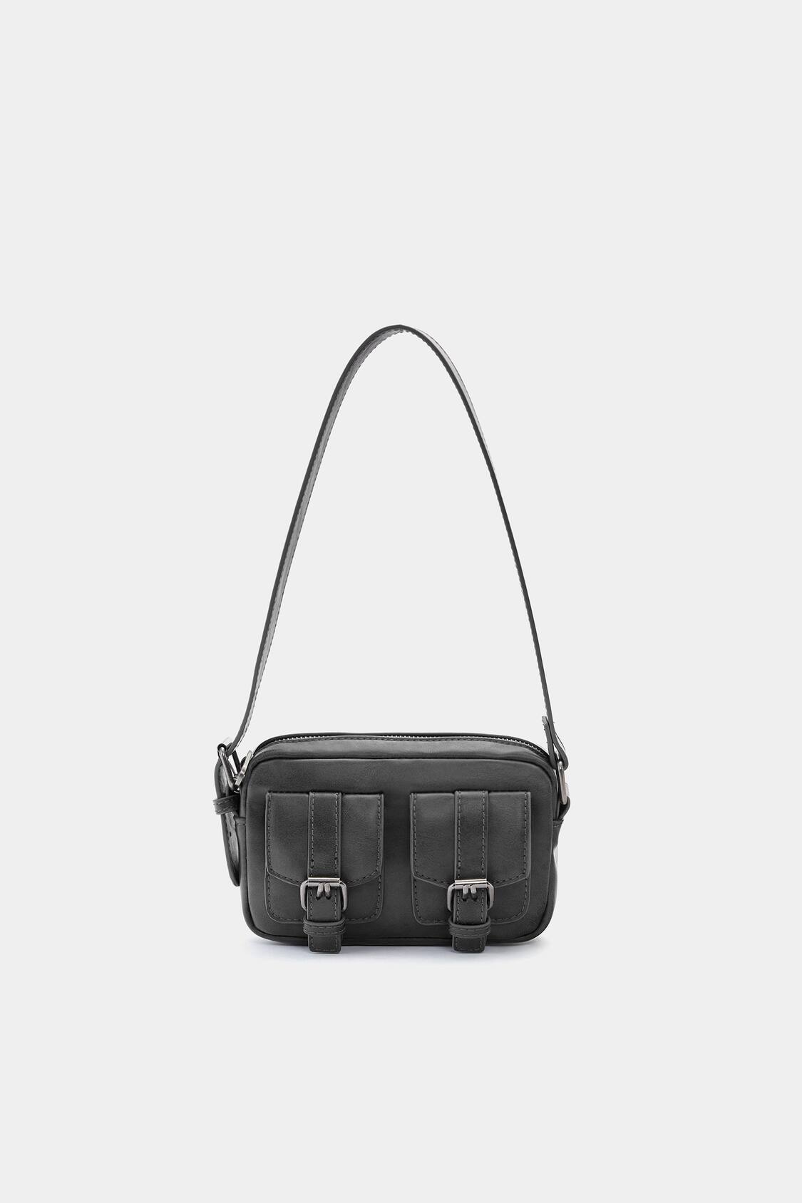 Black quilted cross body bag in 2023