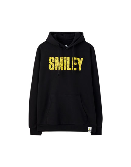 sudadera amarilla fosforita