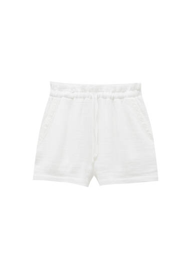 White Bermuda shorts with lace trim