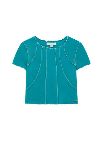 Green t-shirt with visible seam detail