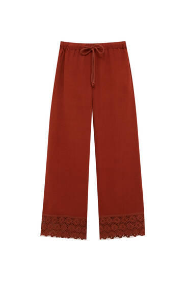 Rustic trousers with crochet detail