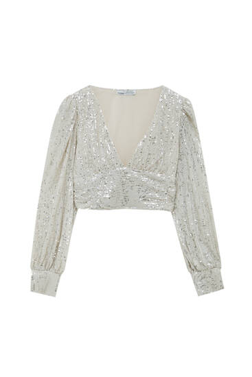 Sequin blouse with voluminous sleeves