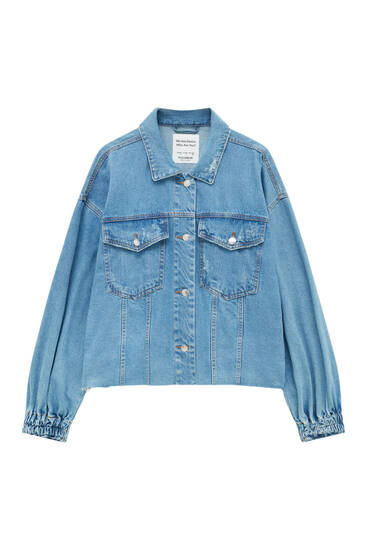 Denim jacket with elastic detail at the back