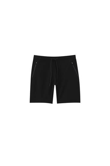 Basic Bermuda jogging shorts with zips