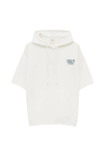 White hoodie with embroidered slogan