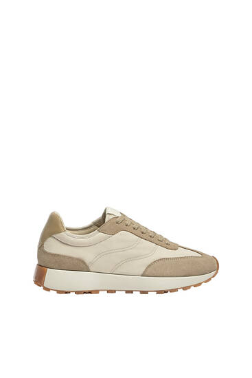 Trainers with leather pieces