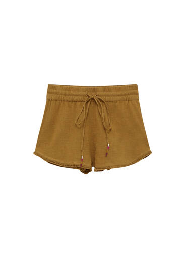Rustic shorts with frayed hems