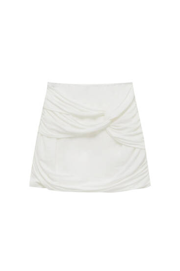 Wrap-style mini skirt with side knot