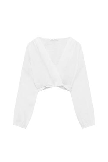 Cropped blouse met cut-out