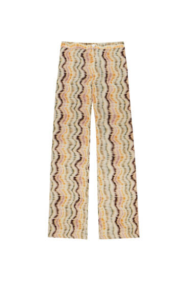 Flare trousers with multi-coloured wave print
