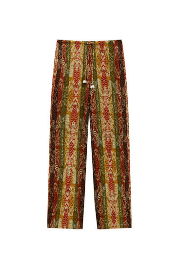 Multicoloured loose-fitting trousers with seashell details