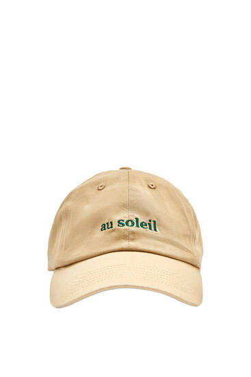 Topi dengan sulaman Au soleil