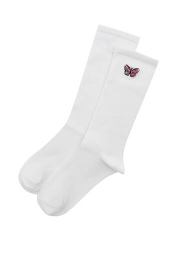 Biele ponožky s vyšívaným motýľom