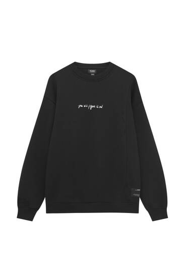 Black hoodie with embroidered slogan