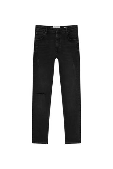 Black carrot fit jeans with ripped detailing