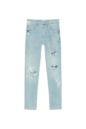 Ripped super skinny jeans with paint splatter