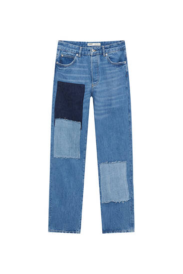 Luźne jeansy z naszywkami
