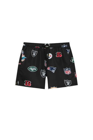 Swimming trunks with NFL shield print