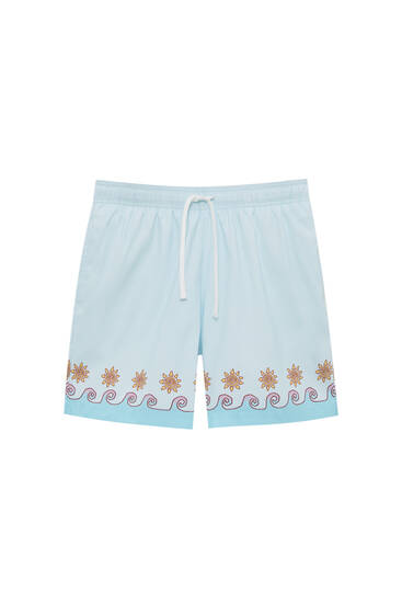 Swimming trunks with a sea print and drawstring