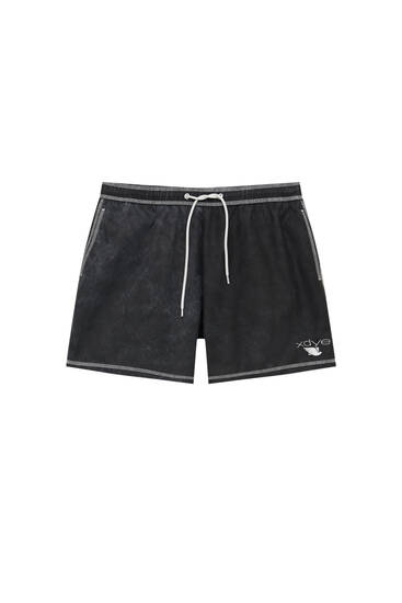 Swimming trunks with contrast seams