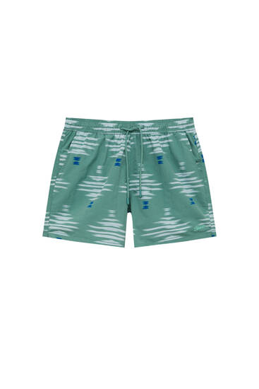 Uneven stripe print swimming trunks