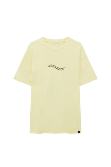 Yellow T-shirt with a slogan graphic