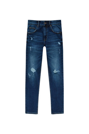 Extra úzké džíny s detaily roztržení