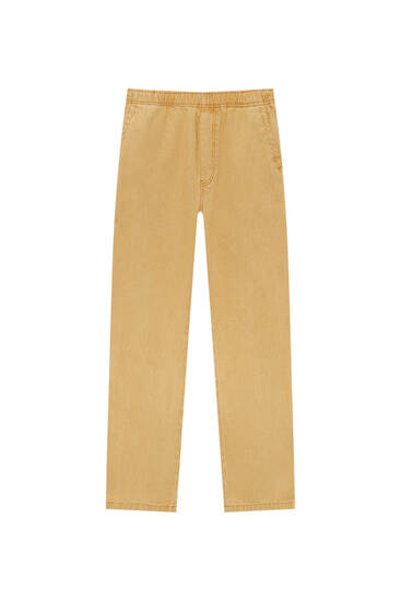 Žlté pruhované džínsy