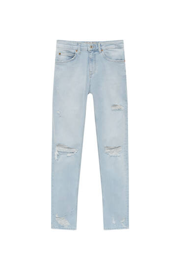 Světle modré úzké džíny s roztržením