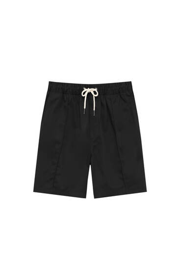Bermuda shorts with elastic waistband and seam detail