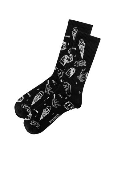 Long socks with embroidered symbols