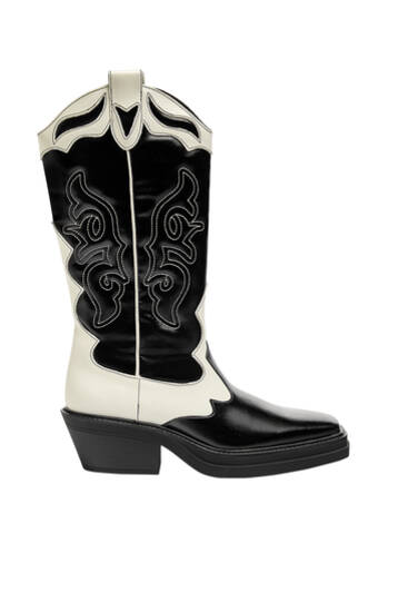 Flat black and white cowboy boots