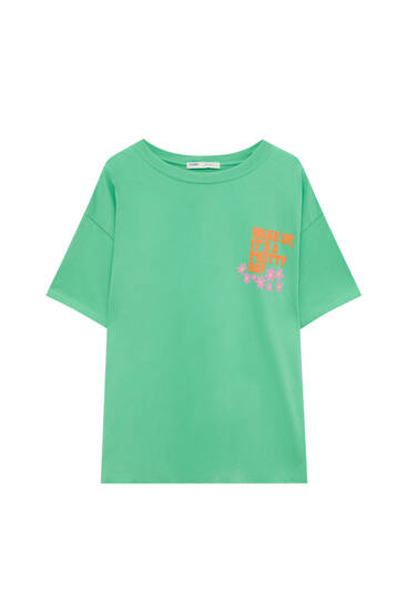 Green T-shirt with graphic and slogan