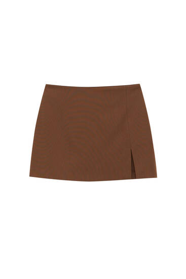 Low-waist mini skirt with slit
