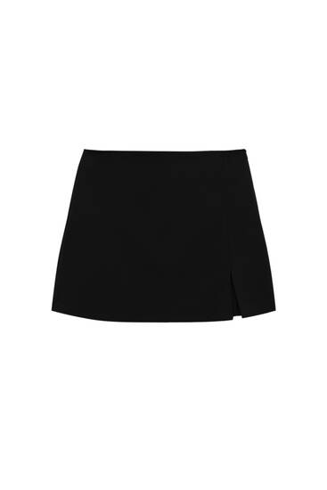 Low-waist mini skirt with slit