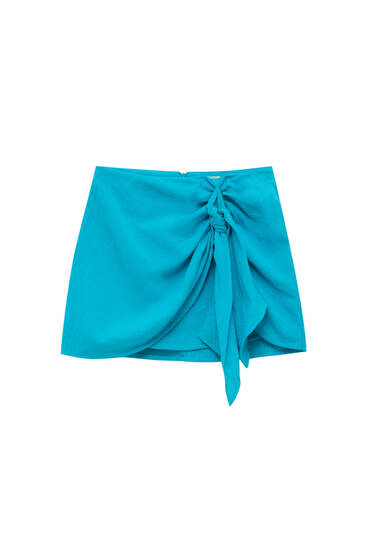 Wrap-style mini skirt with front knot