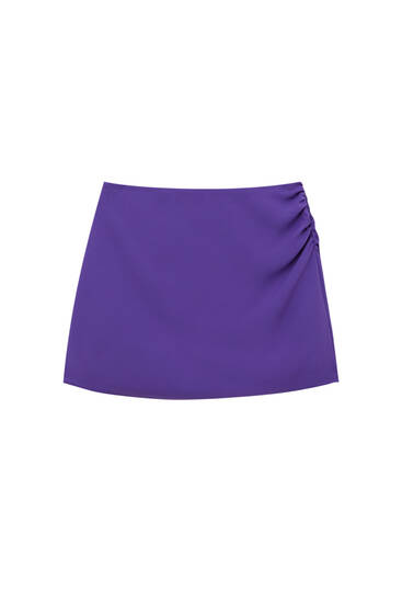 Mini skirt with gathered side