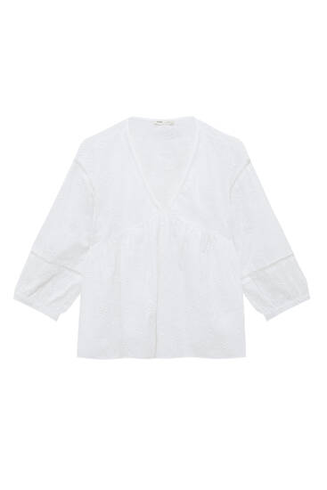 White loose-fitting blouse with embroidery