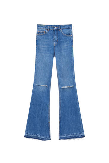 Flared comfort fit jeans met split