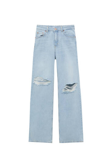 ג'ינס מתרחבים בגזרת high waist עם קרעים