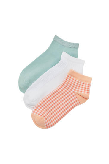 Balení ponožek v jednobarevném provedení a s potiskem