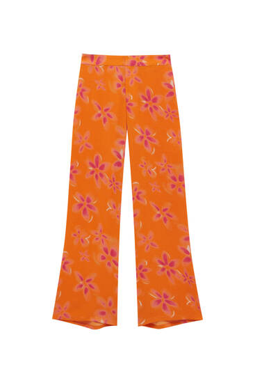 Flowing trousers with floral print