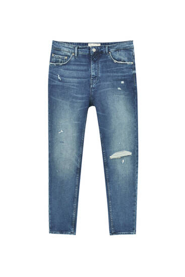 Distressed carrot fit jeans