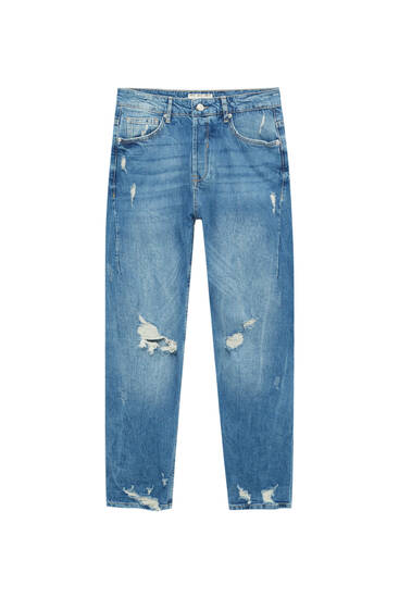 Jeans carrot fit detalle rotos pernera