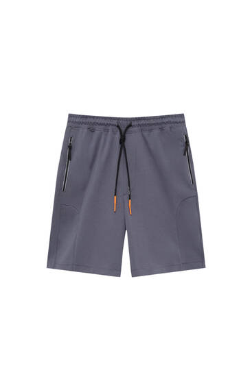 Technical jogger Bermuda shorts with zip pockets