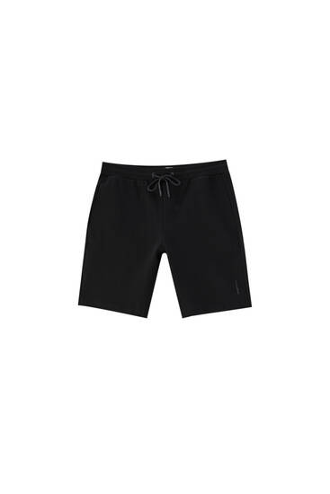 Technical fabric jogger Bermuda shorts - ecologically grown cotton (at least 50%)